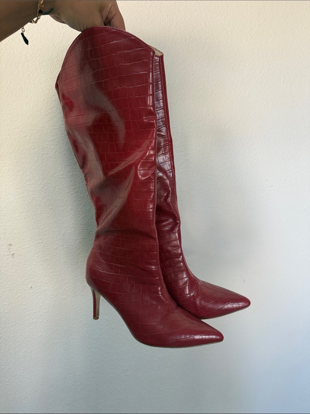 red embossed knee high boots